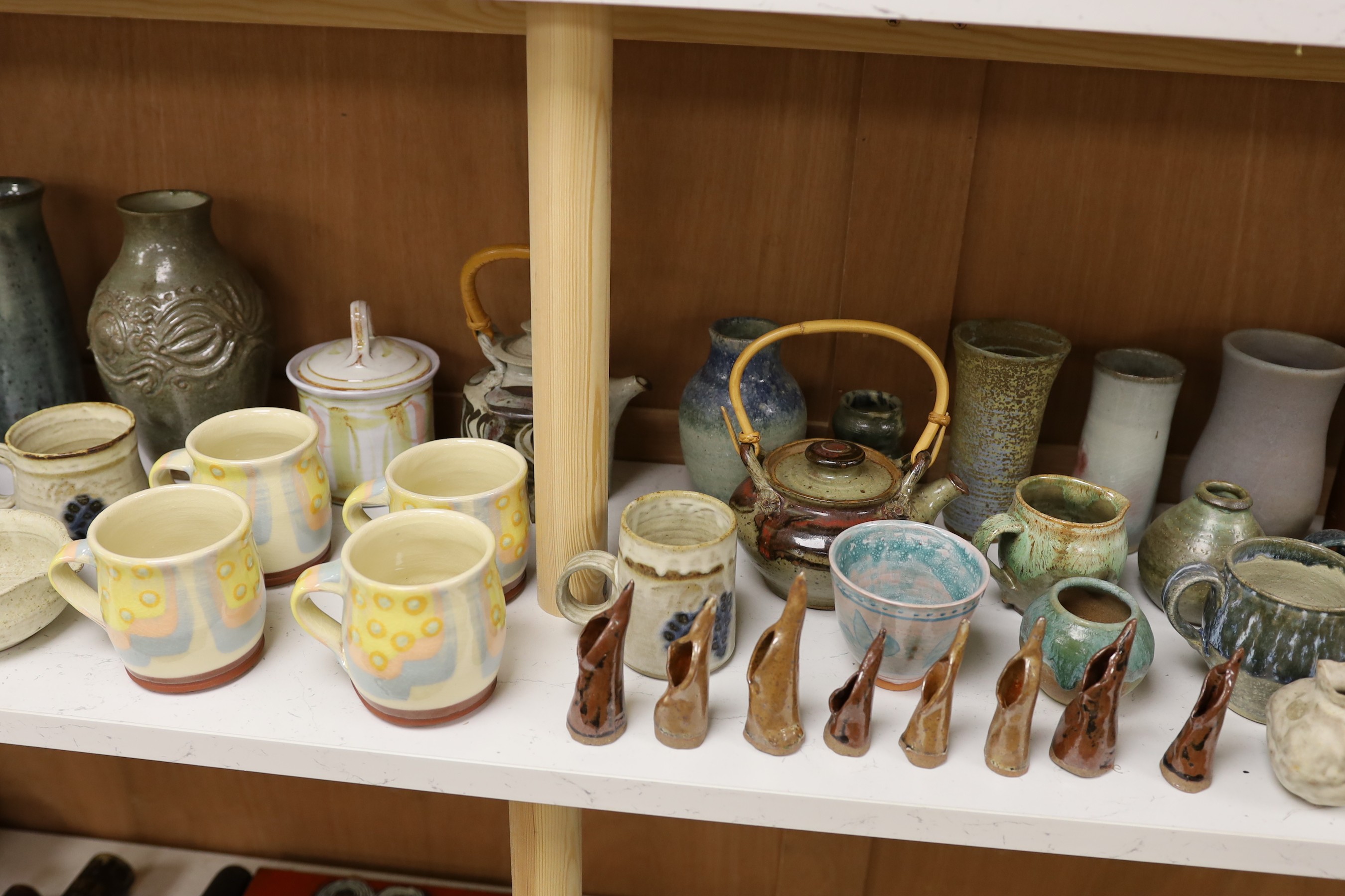 A large quantity of British studio pottery teapots, mugs, jugs and other miscellaneous items, to include a vast amount by Susan Threadgold